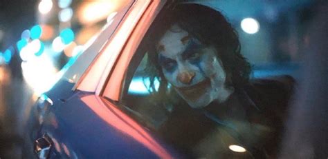 In Joker (2019) Joker looks out a window whilst in the back of the car ...