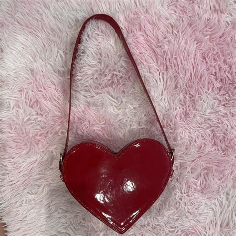 Red heart shaped purse Used once Perfect... - Depop