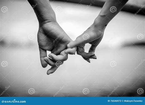 Happy couple holding hands stock image. Image of relationship - 76546973