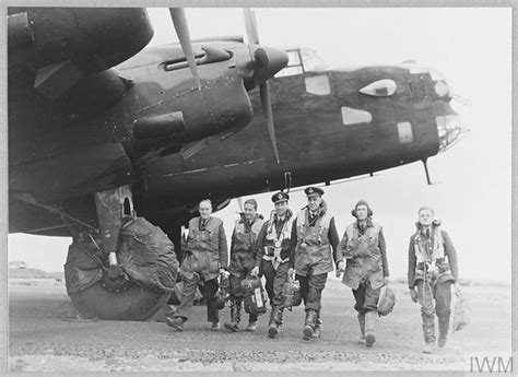 Original wartime caption: The crew of a Halifax leaving their aircraft ...