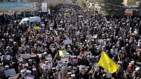 Woman removes hijab in anti-government protests in Iran