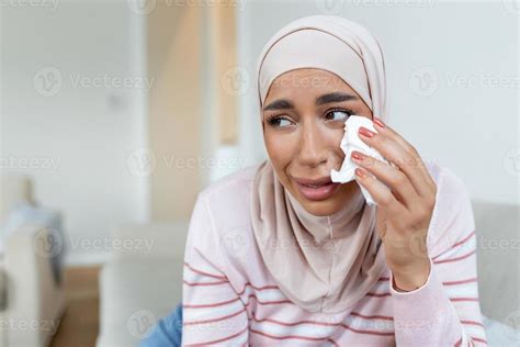 A sad Muslim woman in a hijab, crying. Close-up of a weeping Arab girl ...