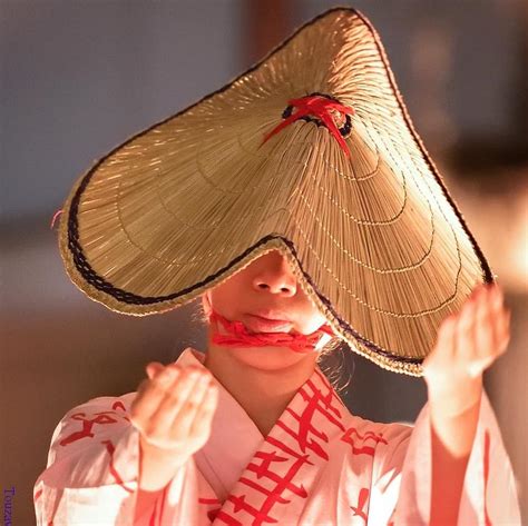 This cone-shaped straw hat is a type of traditional Japanese hat called ...