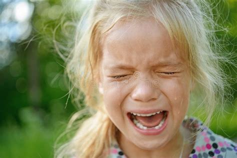 Sad little girl crying stock image. Image of pouring - 34492093