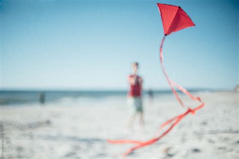 "Boy Flying A Kite On The Beach" by Stocksy Contributor "Léa Jones ...