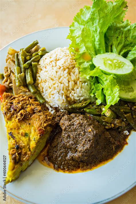 Nasi Padang with beef rendang, a famous traditional cuisine from Padang ...