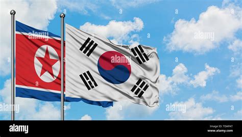 North Korea and South Korea flag waving in the wind against white ...