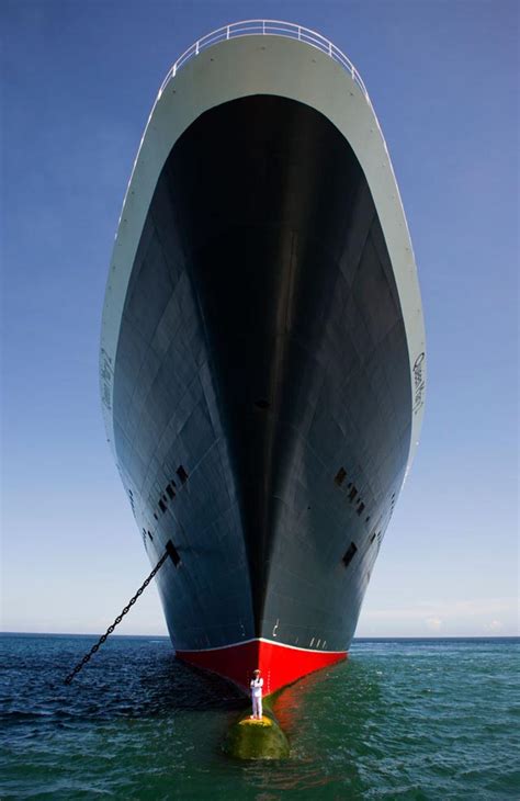 Queen Mary 2 Captain Posing Atop the Ship's Bulbous Bow