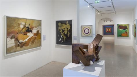 an art gallery with paintings and sculptures on the walls