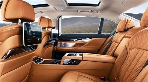 the interior of a luxury car with tan leather