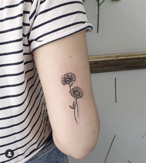 Daisy minimalist tattoo | Classy tattoos, Minimalist tattoo, Cute tattoos