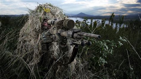 Camouflaged Precision: HD Wallpaper of a Military Sniper