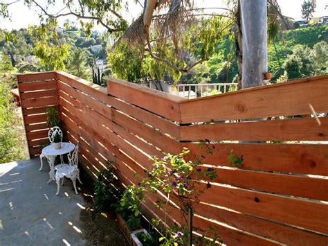 How to Build a Horizontal Plank Fence in a Hillside Backyard | HGTV