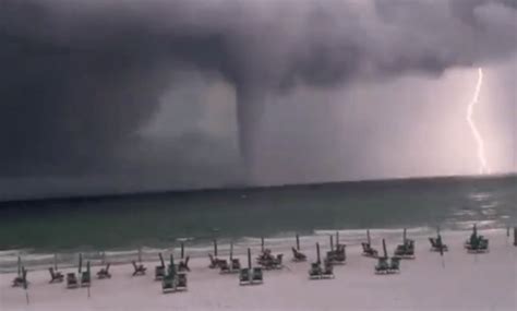 The video shows a giant waterspout in front of the Florida resort ...