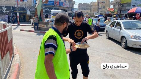 Rafah, southern Gaza Strip: Members of Hamas hand out sweets to passers ...