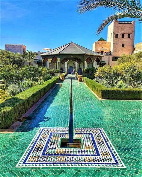 an intricately designed walkway in the middle of a courtyard with blue ...