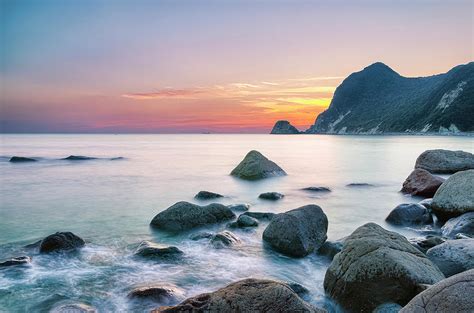 Calm Sunset At Ihama Rocky Beach by Tommy Tsutsui