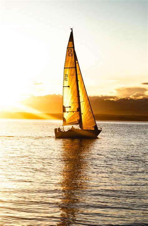 Silhouette Of Sailboat On Sea During Sunset · Free Stock Photo