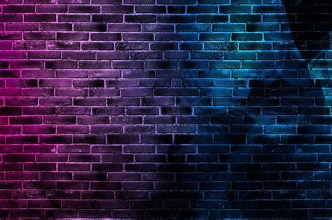 Premium Photo | Black brick wall background with neon and glowing lights.