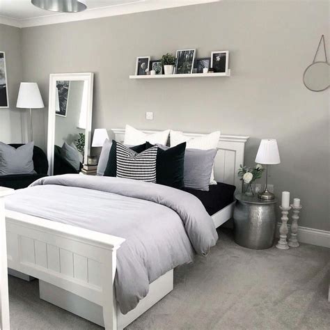 Light grey and white modern bedroom with picture shelf styling and ...