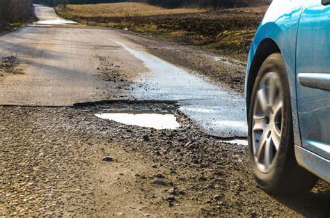 Why You Should Avoid Potholes in the Road - DeBroux Automotive