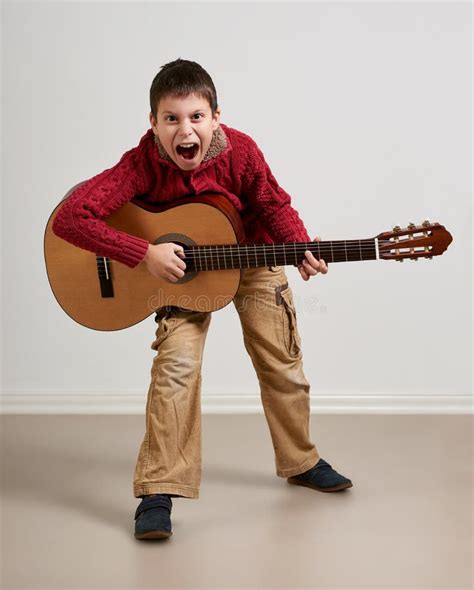 Boy Having Fun with Guitar, Making Music and Singing Stock Image ...