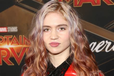 Did Grimes Remove Part of Her Eyeball in an Experimental Surgery?