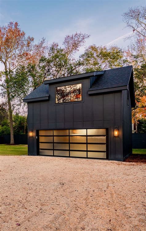 Ultra modern all black detached garage with double wide door and living ...