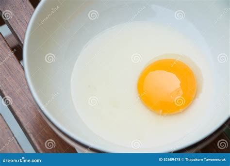 Raw egg yolk on the dish stock photo. Image of cooked - 52689478