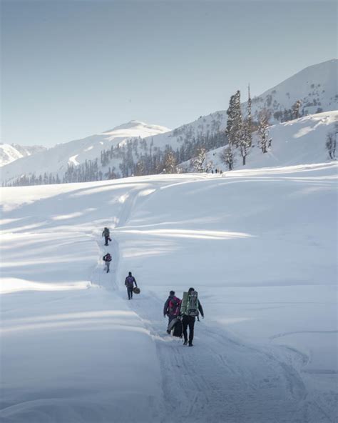 People Walking on Snow Covered Field · Free Stock Photo