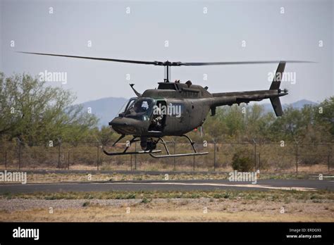 An OH-58 Kiowa helicopter of the U.S. Army landing at Pinal Airpark ...