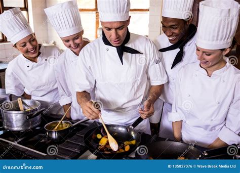 Group of Chefs Preparing Food in Kitchen Stock Photo - Image of chef ...