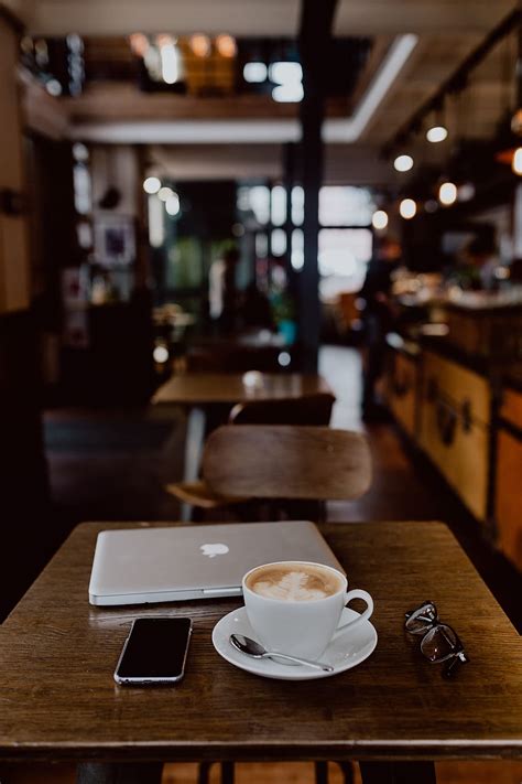 HD wallpaper: Cup of coffee on table in cafe, interior, tech ...