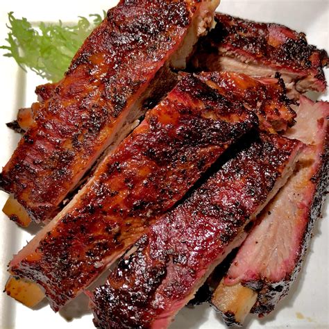 Probably the best pork ribs i’ve ever smoked. Came out super tender ...