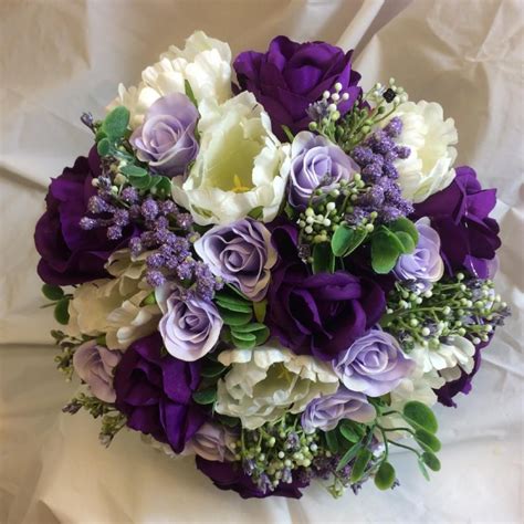 - A brides bouquet of purple, lilac and ivory silk roses & tulips ...