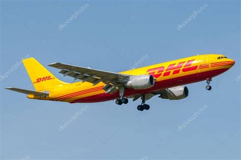 DHL airplane during landing – Stock Editorial Photo © okfotopuntoit ...