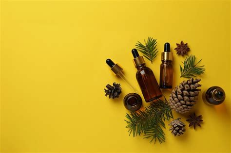 Premium Photo | Aromatherapy concept with pine oil on yellow