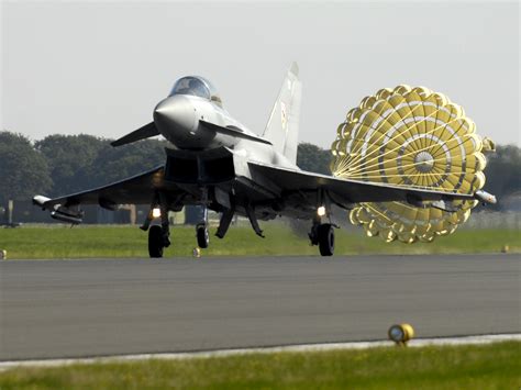 A_Typhoon_F2_fighter_jet_deploys_a_brake_parachute_as_it_lands_at_RAF ...