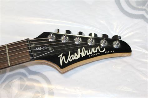 WASHBURN MERCURY SERIES MG20 ELECTRIC GUITAR - Big Valley Auction