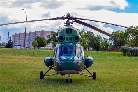 Green Military Helicopter is Landing in the City Street Park. Stock ...