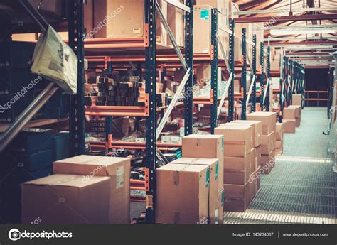 Crates and boxes on a shelves in a warehouse — Stock Photo © nejron ...