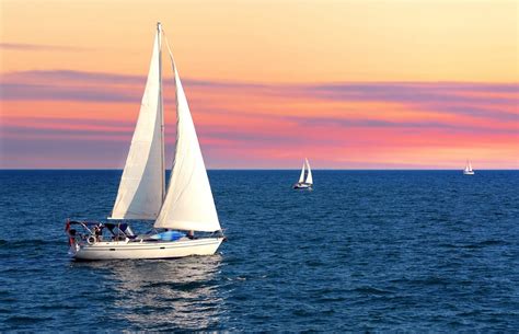 Sailboats on the water during sunset - Hope and Glory Inn