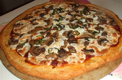 Beef and mushroom pizza with fresh mozzarella and homegrown bell ...