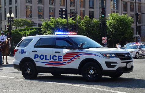 a police car is parked on the side of the road