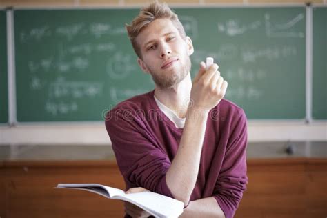 University Young Male Professor Teaching Students in University Holding ...