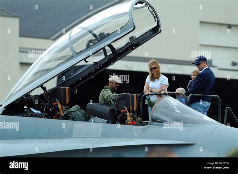 American jet fighter F-18 Hornet cockpit with pilot and american family ...