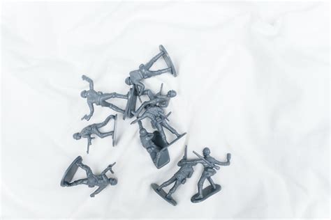 Toy Soldiers on White Sheet · Free Stock Photo