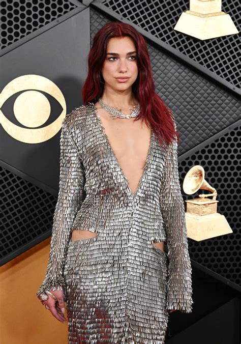 Dua Lipa Shimmers in Silver Courrèges Dress on the 2024 Grammys Red Carpet