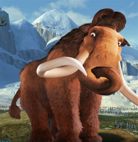 the wooly mammoth is standing in front of some snowy mountains and snow ...