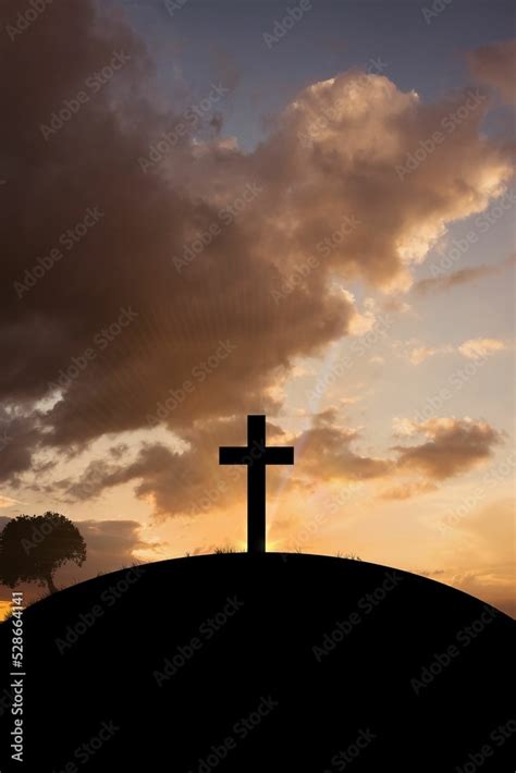 Cross religion symbol shape over sunset sky Stock Photo | Adobe Stock